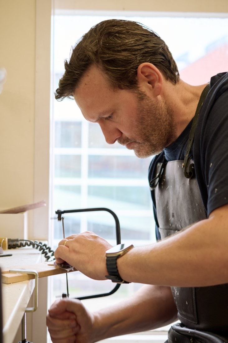 Gavin Winstanley hand-cutting an acetate frame in the Park Road workshop